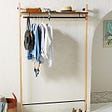 Wall-mounted clothing rack