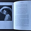 A photo a book opened to a chapter about Jeanette Rankin showing a photo of her.