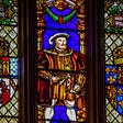 Image of Henry VIII pictured on a church, stain glass window.
