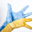 A hand painted with the Ukraine colors