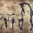 Cave painting with three human figures and two giraffs.