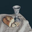 The chalice of the Holy Grail and a loaf of bread