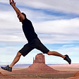 Man jumping on canyon