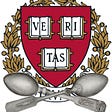 The Harvard crest with a pair of crossed silver spoons beneath it.