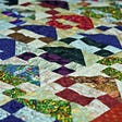 Image of a colorful quilt.