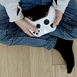Picture of boy sitting holding a video game xBox controller