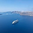 A cruise ship in the caldera of the Santorini volcano.