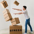 Man pushing over boxes related to what causes stress.