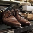 A brown leather shoe repaired at f & C, looking all new