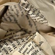 Crumpled paper with words printed on them | Check out Lifelog — golifelog.com/learn-more