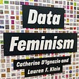 A photograph of the Data Feminism jacket cover, showing the title “Data Feminism”, authors Catherine D’Ignazio and Lauren F. Klein, and a backdrop of hundreds of data visualizations.