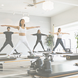 Exercise provides a wealth of benefits — shown in photograph is pilates in community
