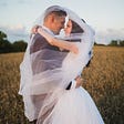 Two Love birds (husband and wife) hugging each other in beautiful fields