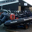 Image of a Rigid Inflatable Boats (RIB) on a trailer in the compound of the Hornsea Inshore Rescue centre
