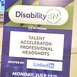 Purple and Green Standee Board that read’s “Disability:In, In for Inclusion, Talent Accelerator: Professional Headshots, Hosted by: Linkedin.”