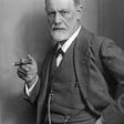 A picture of Sigmund Freud, father of Psychology, holding a cigar.