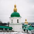 Pechersk Lavra, Monastery & Cave System in Kyiv, Ukraine. Golden domed, green roofs and ornate white buildings in a snowy landscape.