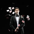 A magician throwing cards away