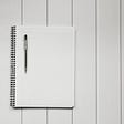 A blank sheet of paper in the notebook