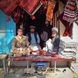 Wilthew with rug sellers in Mazar-e-Sharif