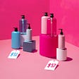 Madison Campbell shares an image from Good Housekeeping on “Pink Tax”, showing a blue item for $51.00 and a pink item for $57