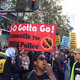 Shani shown on the megaphone at a protest against police violence in San Francisco California, 2014