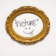 A gold, oval picture frame with the word “picture” and a smiley face drawn inside