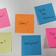 Image of 6 post it notes, saying: Motivation? Salary? Sprints, tests, maintenance, Team? Development? Tech and kit?