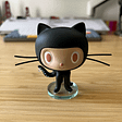 A figurine of Mona, GitHub’s mascot, on a desk.
