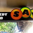 Photo of SAK Comedy Lab’s sign on South Orange Ave in Downtown Orlando, Florida