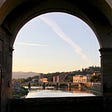 River view of Florence, Italy, from under an archway.