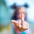 Woman giving middle finger sign