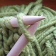 Green yarn being knit