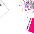 Colorful graphic with keyboard, color and pink notebook
