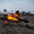 Campfire burning on a beach
