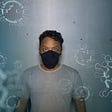 Guy with mask scared by covid-19 corona virus self-isolation covid