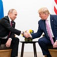 Donald Trump and Vladimir Putin seated side by side and shaking hands in front of the Russian and American flags.