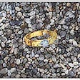 Engagement ring tossed into gravel