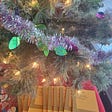 A set of theatre scripts sitting under the Christmas Tree