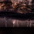 Thunderstorm with dark clouds and multiple bolts of lightening