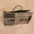Handmade carry bag made from newspaper and twine