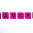 Picture of the word cancer spelled out with pink scrabble tiles.
