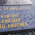 An engraving that reads: “A Translation — From One Language to Another