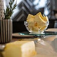 butter in glass dish with nice dining background