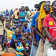 refugees-falling-in-line-for-food-and-milk