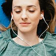 A girl listening to music and feeling contented