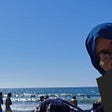 A Girl in Hijiab at the Beach