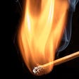 A burning matchstick