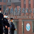 Security personnel at the Wuhan Institute of Virology during the visit by a World Health Organization team investigating the origins of COVID-19, in Wuhan, China, February 3, 2021. Photo by Thomas Peter/Reuters