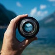 View of a mountain lake through a camera lens